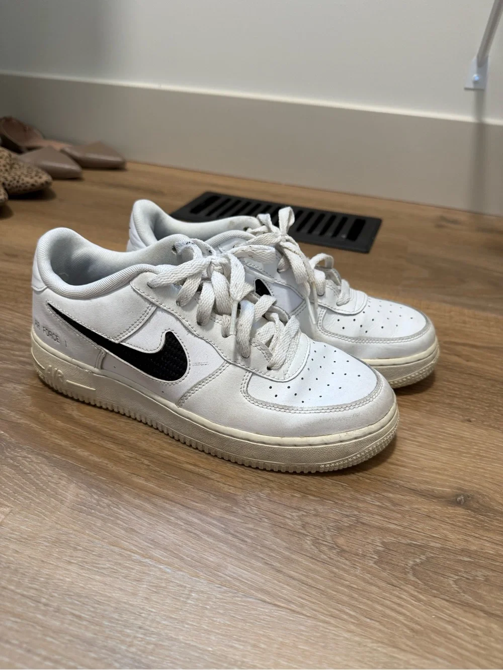 Nike Air Force 1 White Sneakers with Black Swoosh
